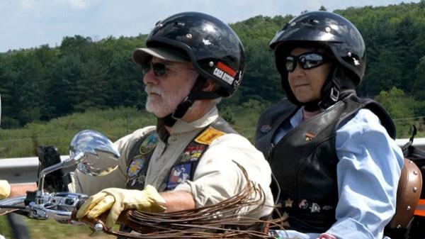 WKD Patient riding on the back of a motorcycle with her husband